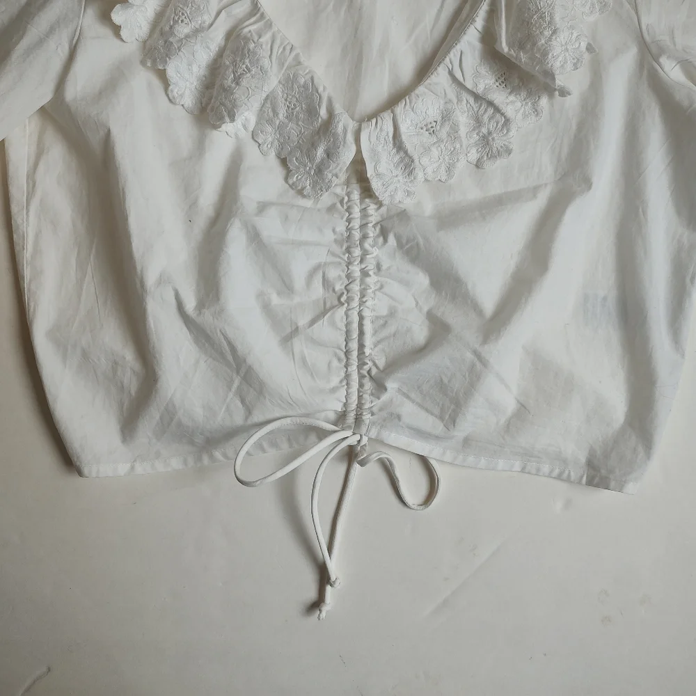Maeve White Ruffled V-Neck Drawstring Blouse